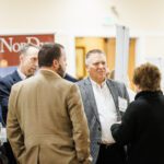 NETC team members engaging in advocacy conversation with industry stakeholders.